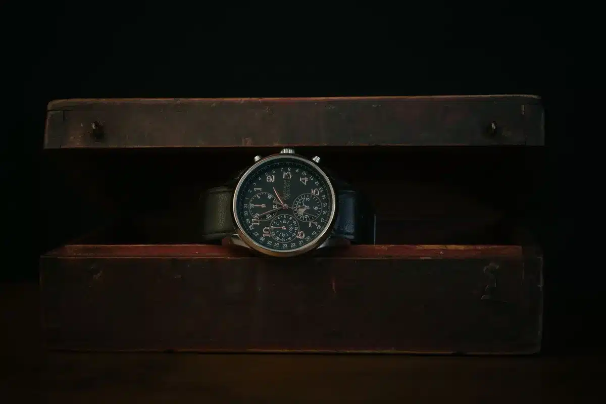 A premium ceramic watch case catching light, smooth white surface with subtle texture, luxury finish detail, close-up on material craftsmanship