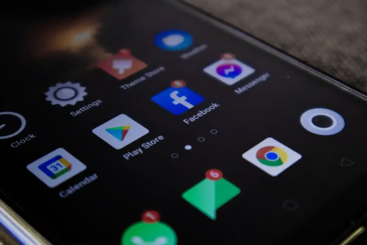 Smartphone screen showing Strava privacy settings menu with visibility options and map hiding controls. Anonymous finger touching screen. Soft lighting.