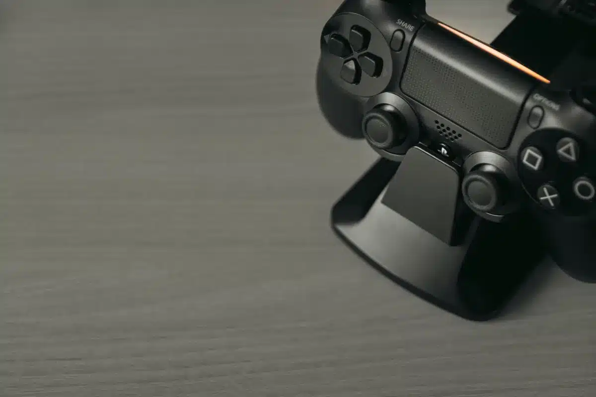 Empty TV with gamepad on a coffee table, game menu visible on screen