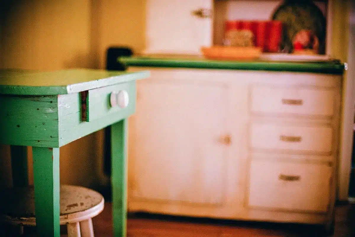 anonymous kitchen drawer with adjustable dividers holding pans and lids separated by size, no logos