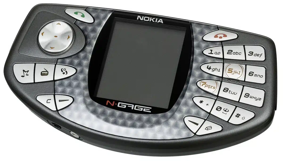 Scene of an empty living room with a generic unbranded gaming console on a low table, a compact handheld device beside it, soft ambient lighting suggesting anticipation